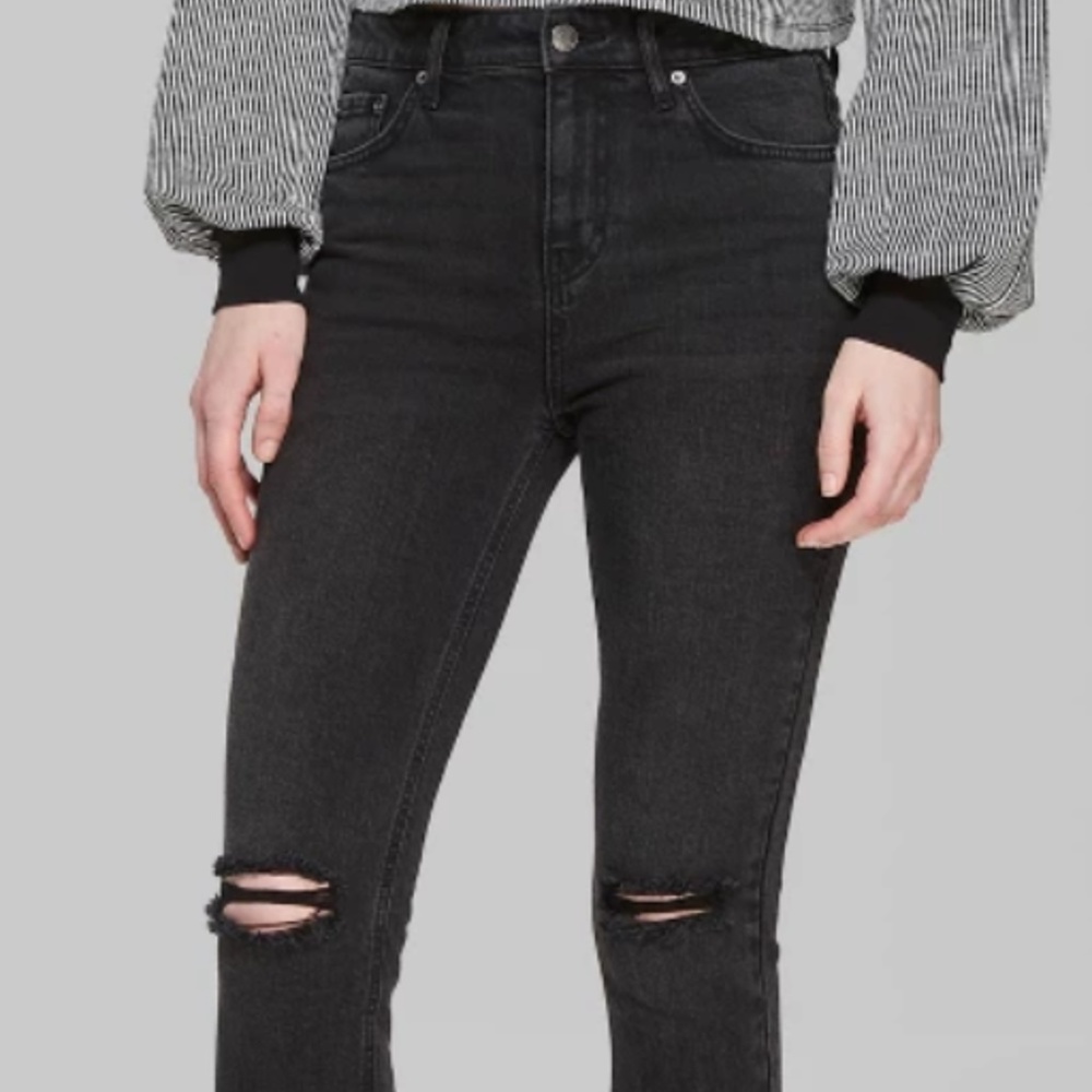 Distressed black skinny jeans